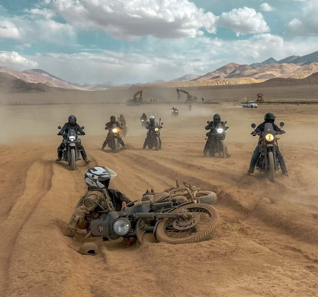 Riders cruising through rugged mountain landscapes on a Ladakh bike trip