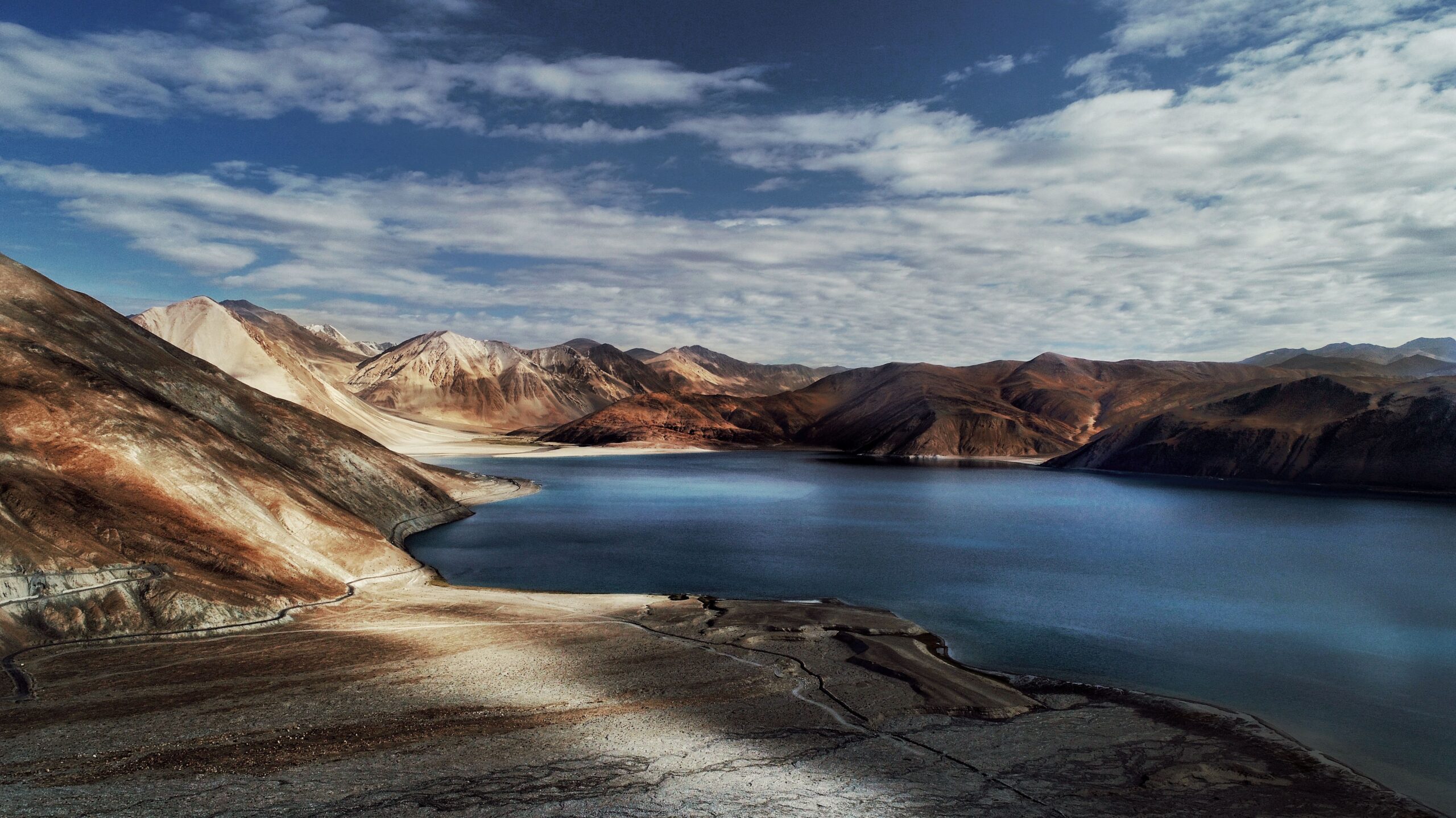 Rider cruising down the endless highways of Ladakh