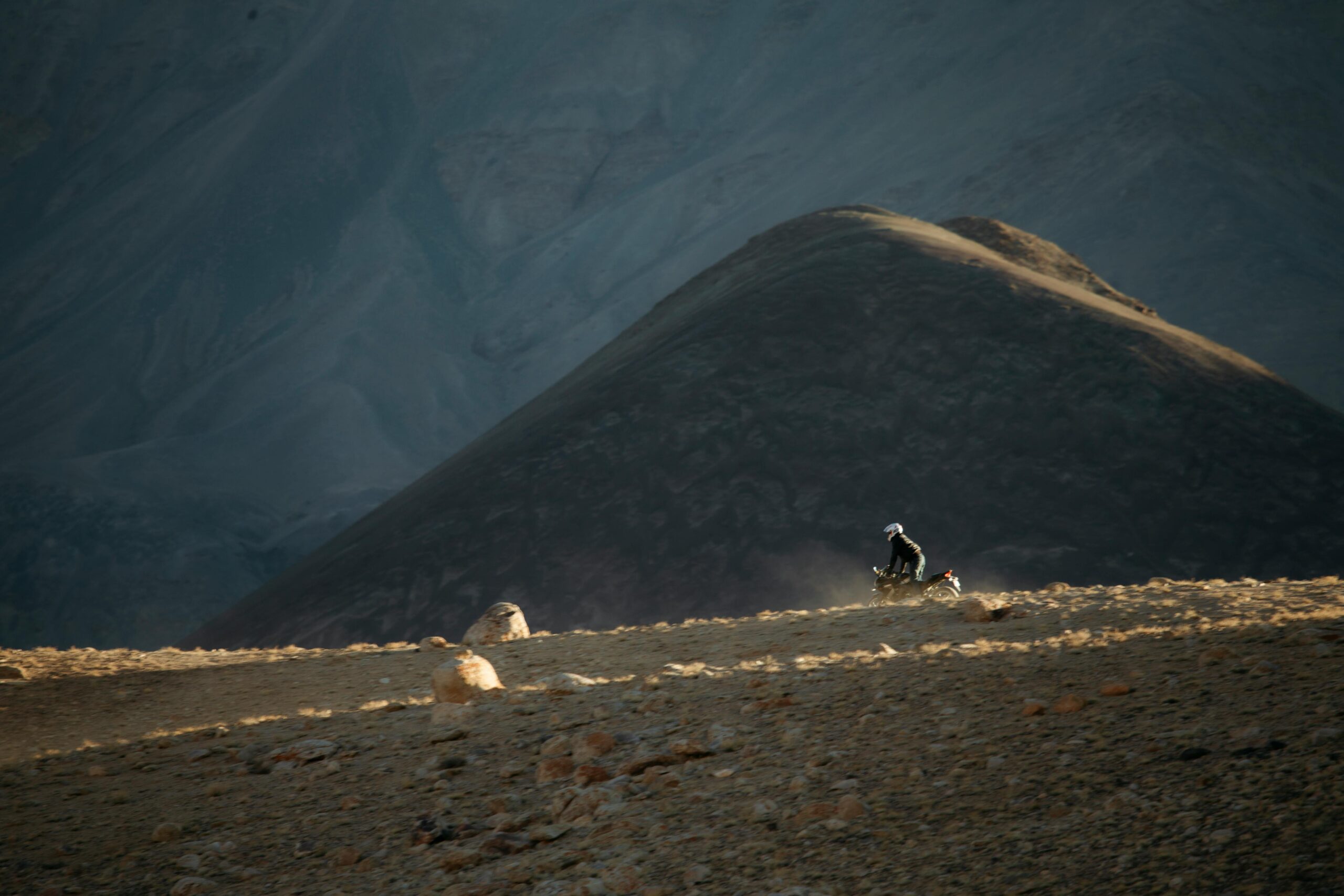 Bikes parked against majestic Himalayan peaks